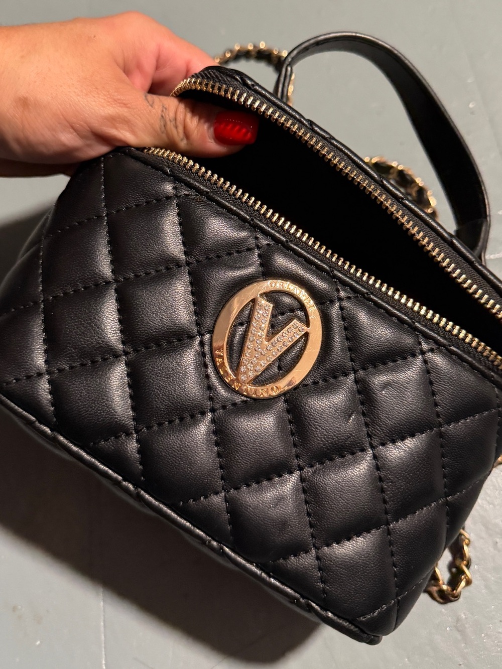 Quilted Black Crossbody Bag with Gold Emblem